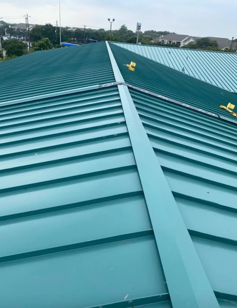 Green commercial metal roof ridge and valley for Metal Roof Repair in Brattleboro